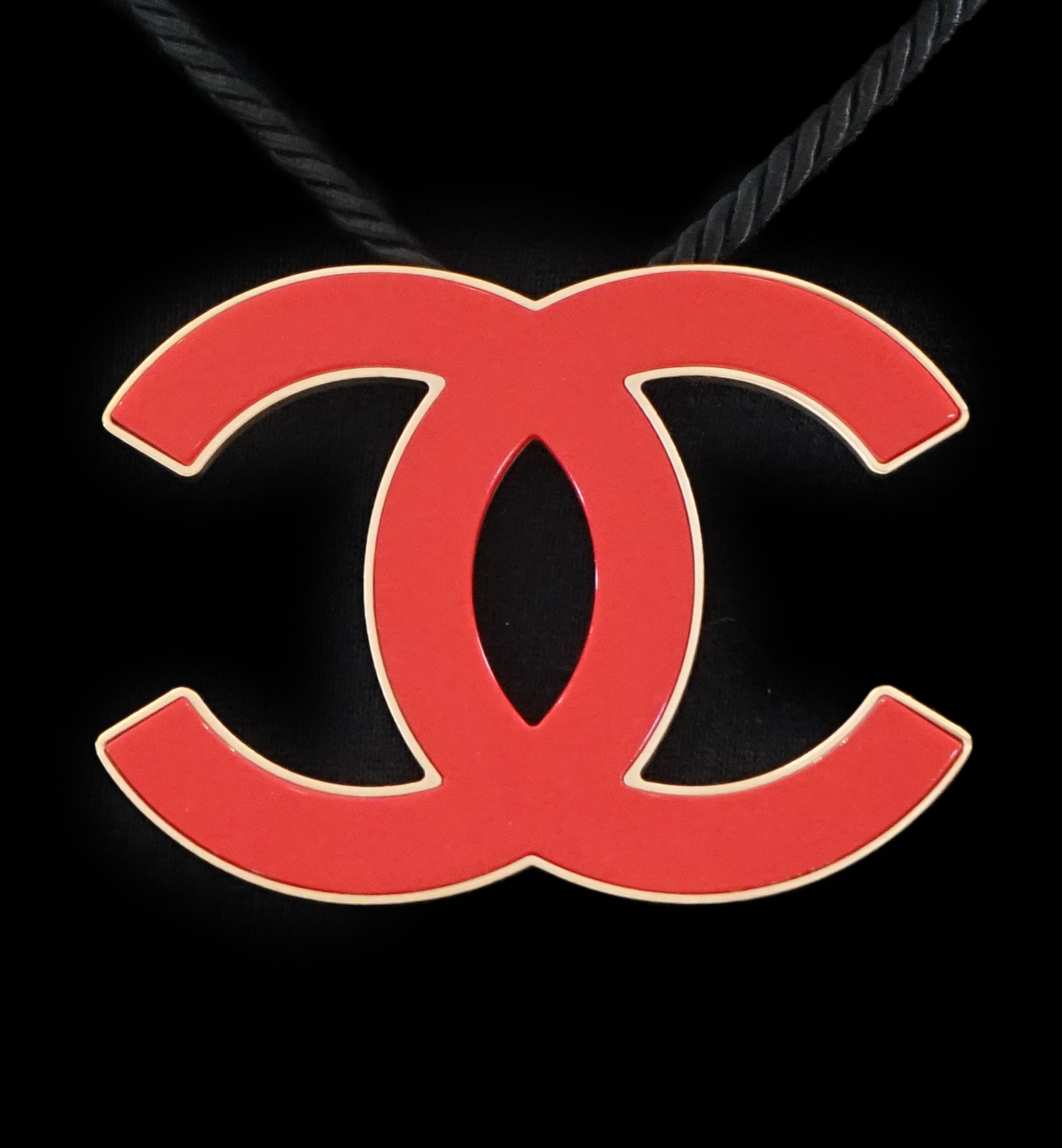 A Chanel CC red metal enamel and gold hardware fabric large choker evening necklace, cord length 39.5cm, charm width 10.75cm, height 8.25cm